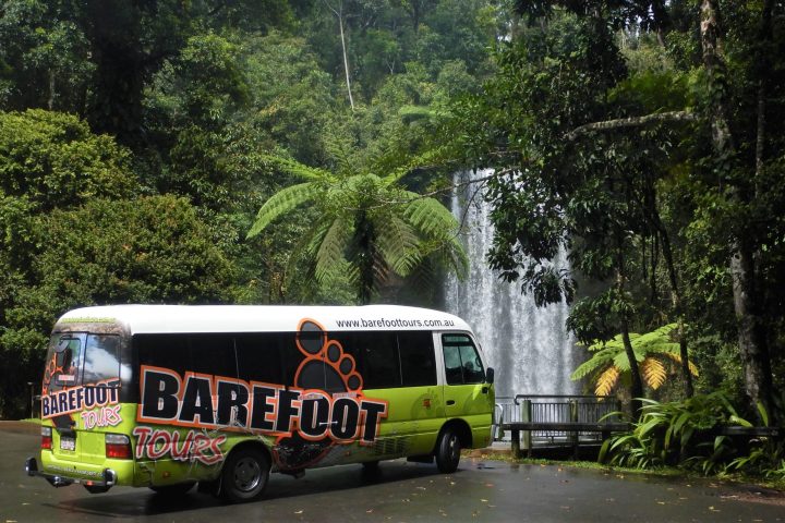 a tour bus driving down a street