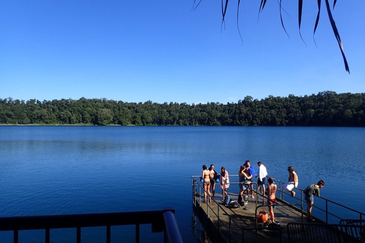 a group of people in a boat on a body of water
