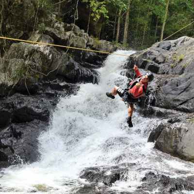 a man riding on the back of a waterfall
