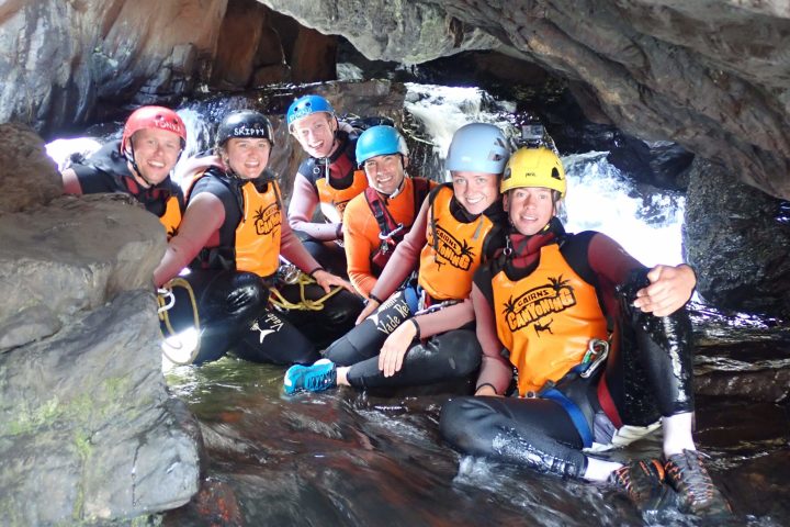 a group of people riding skis on a snowy mountain