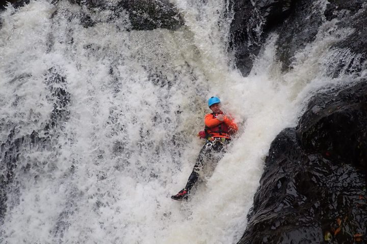 a man riding a wave on a surfboard in the water